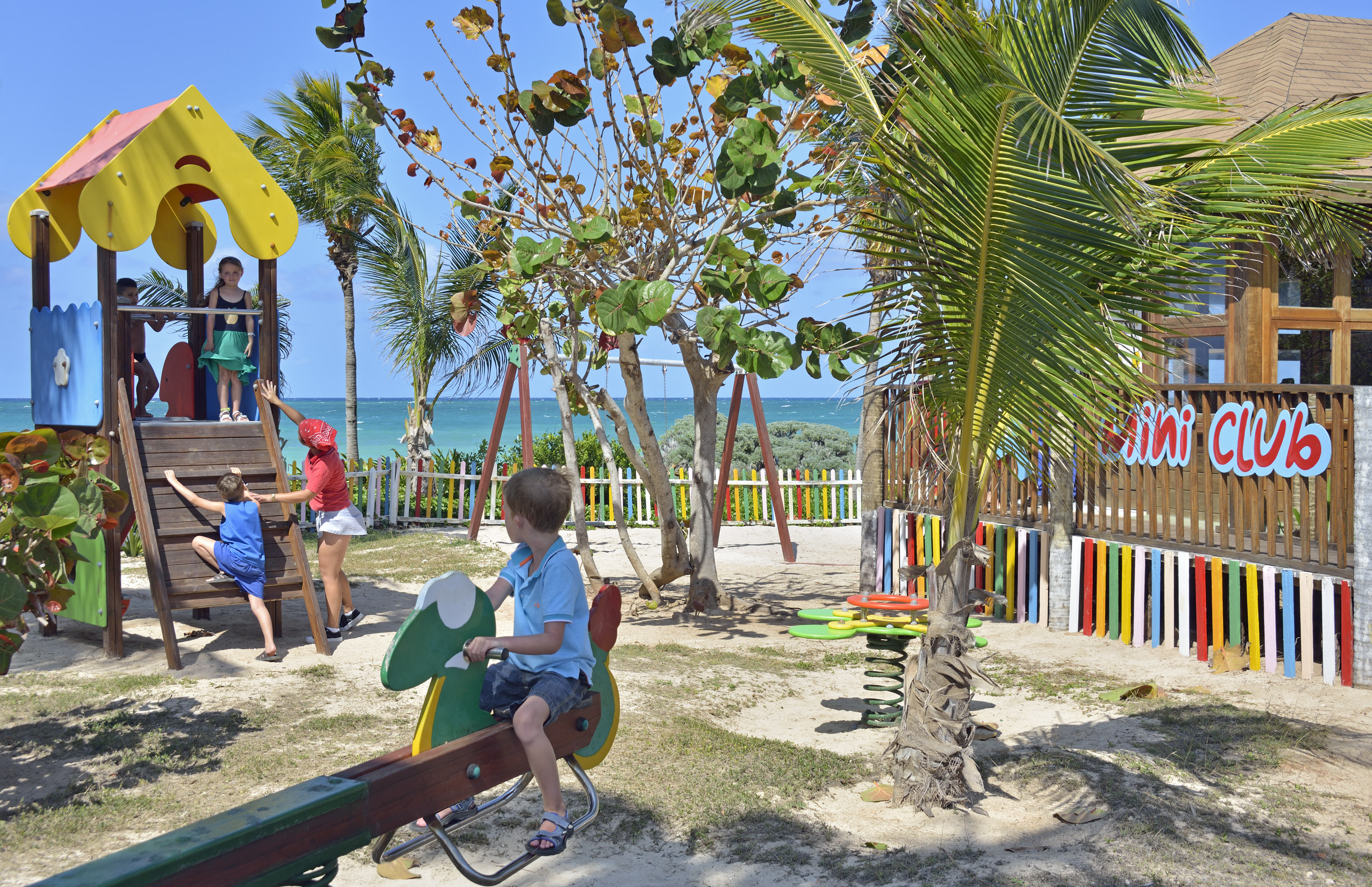 a child on a seesaw in a park