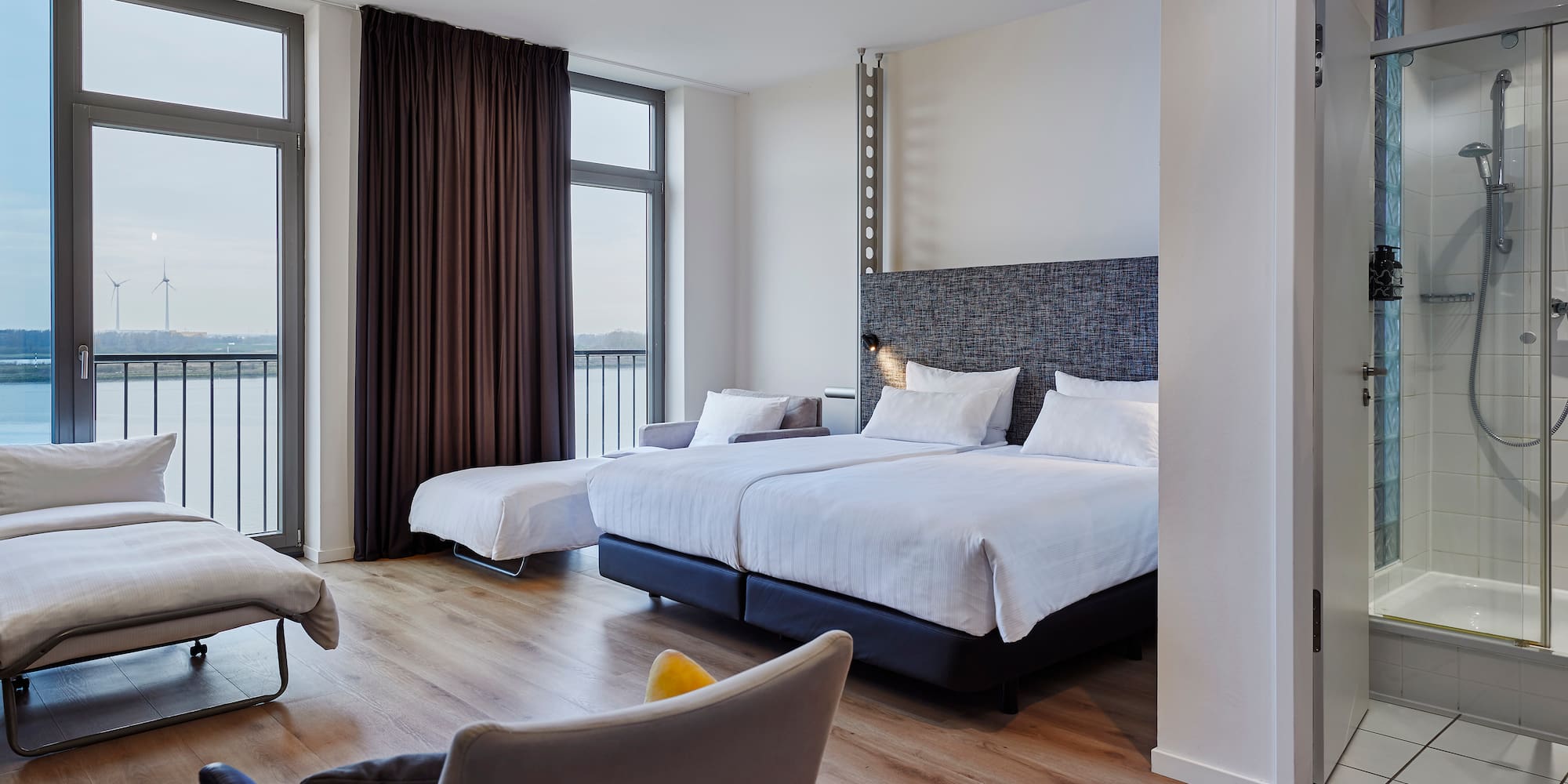 a room with two beds and a couch