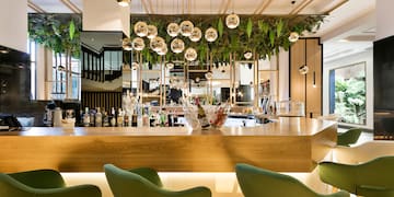 a bar with a counter and chairs
