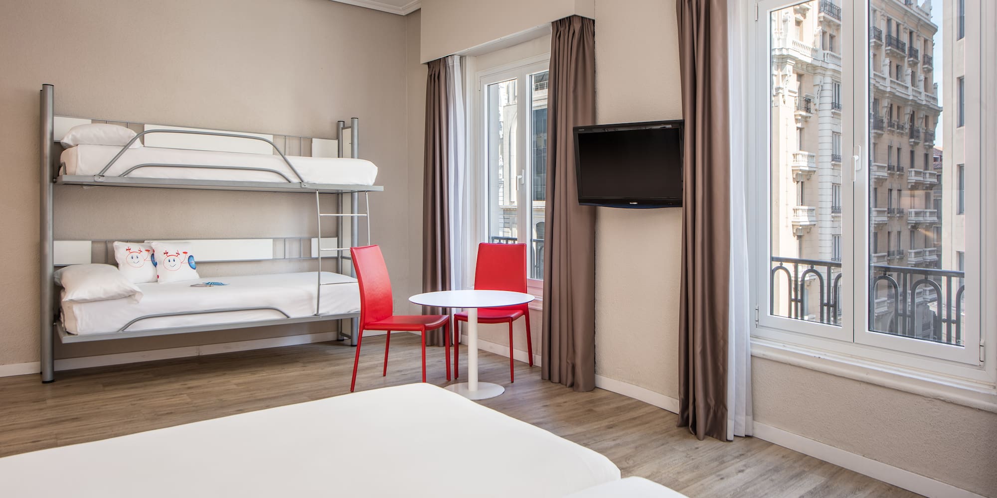 a room with bunk beds and a tv