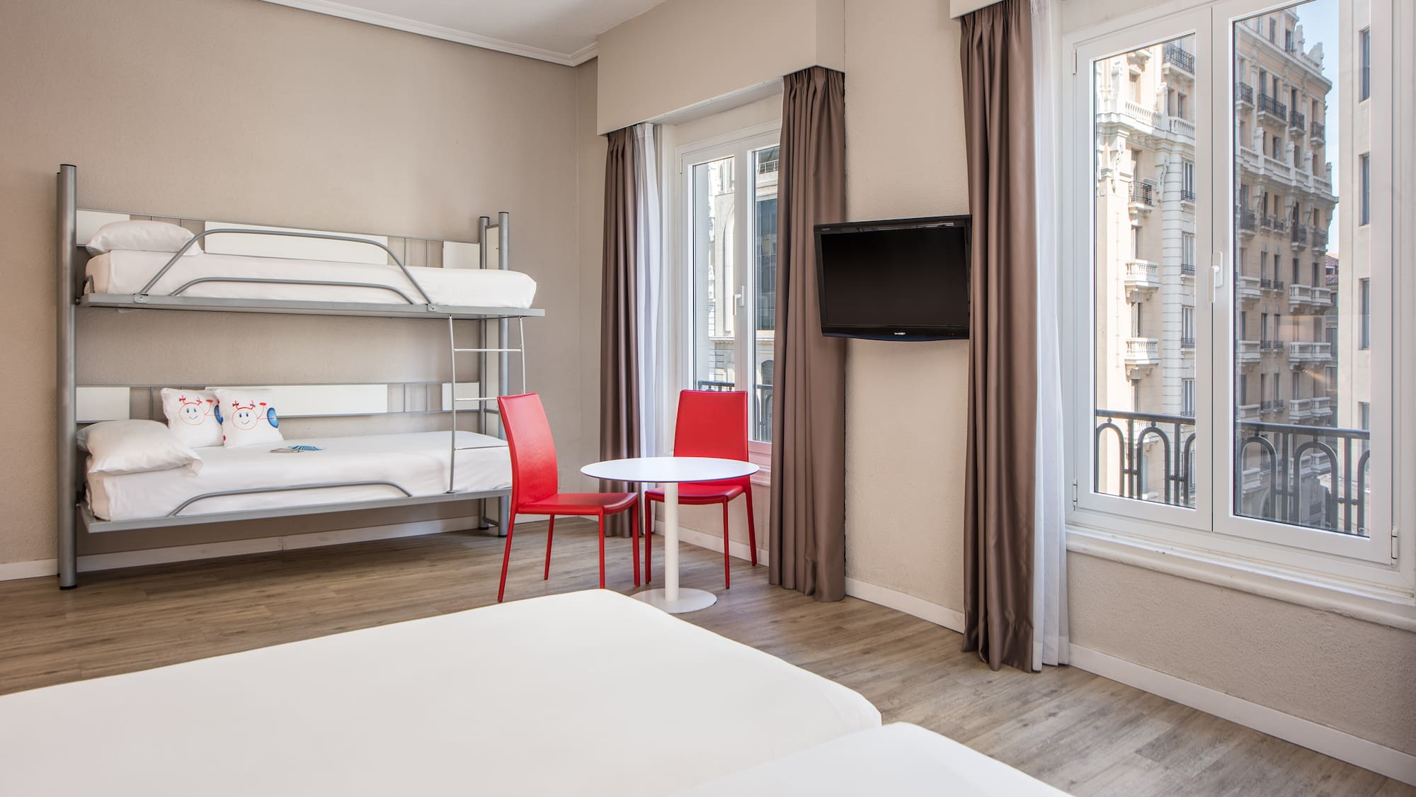 a room with bunk beds and a tv