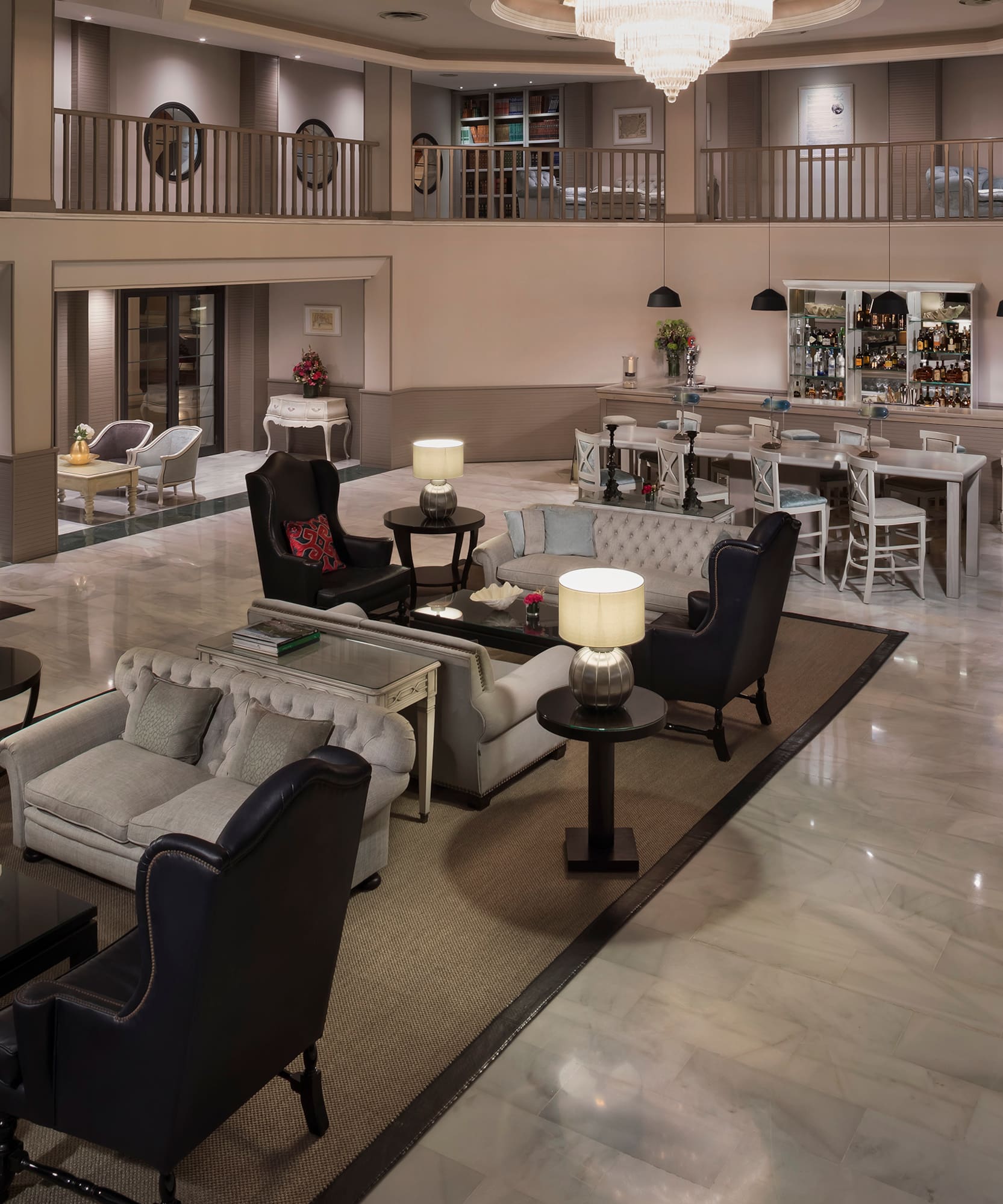 a large room with a large chandelier and chairs
