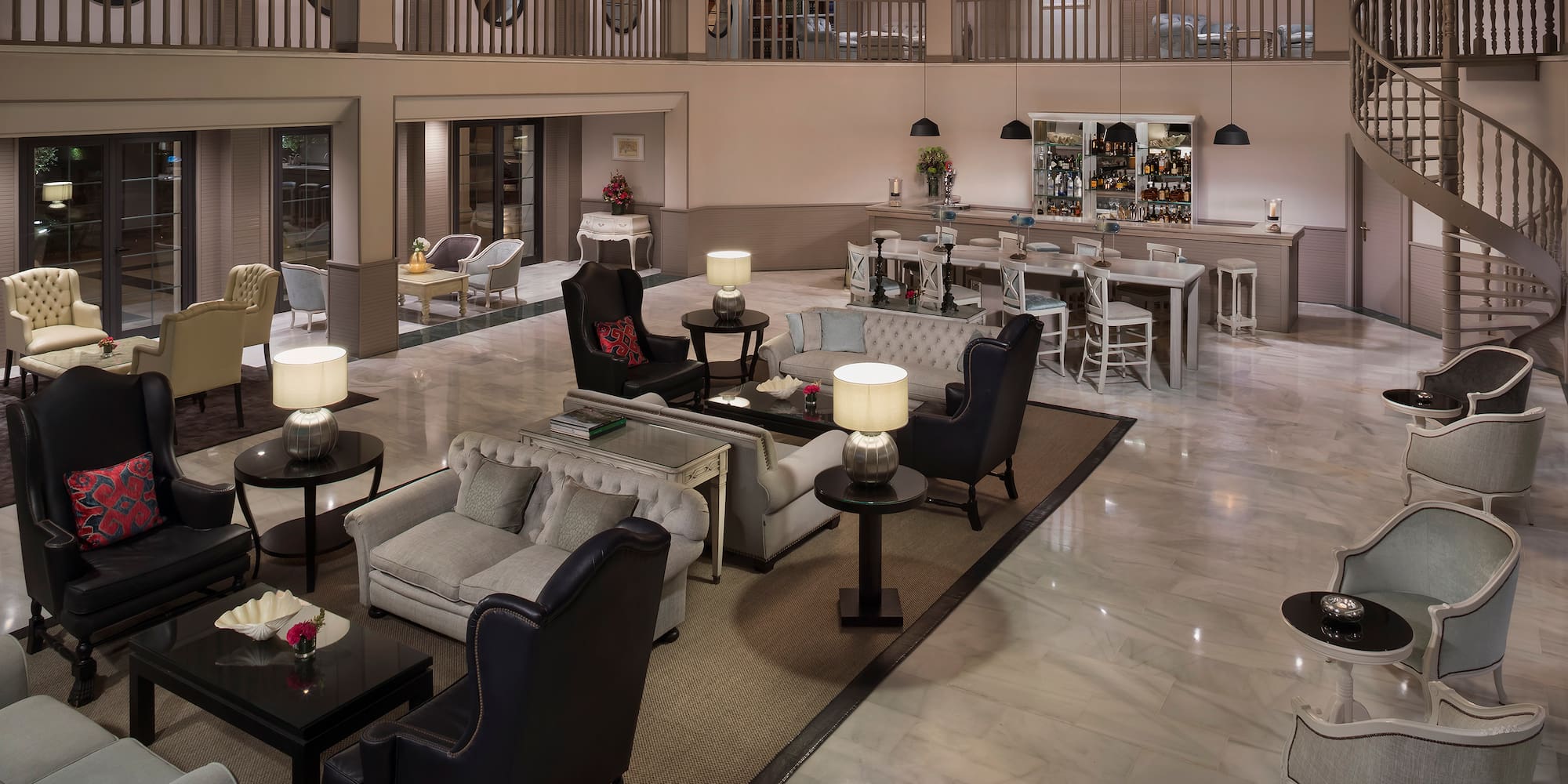 a large room with a large chandelier and chairs