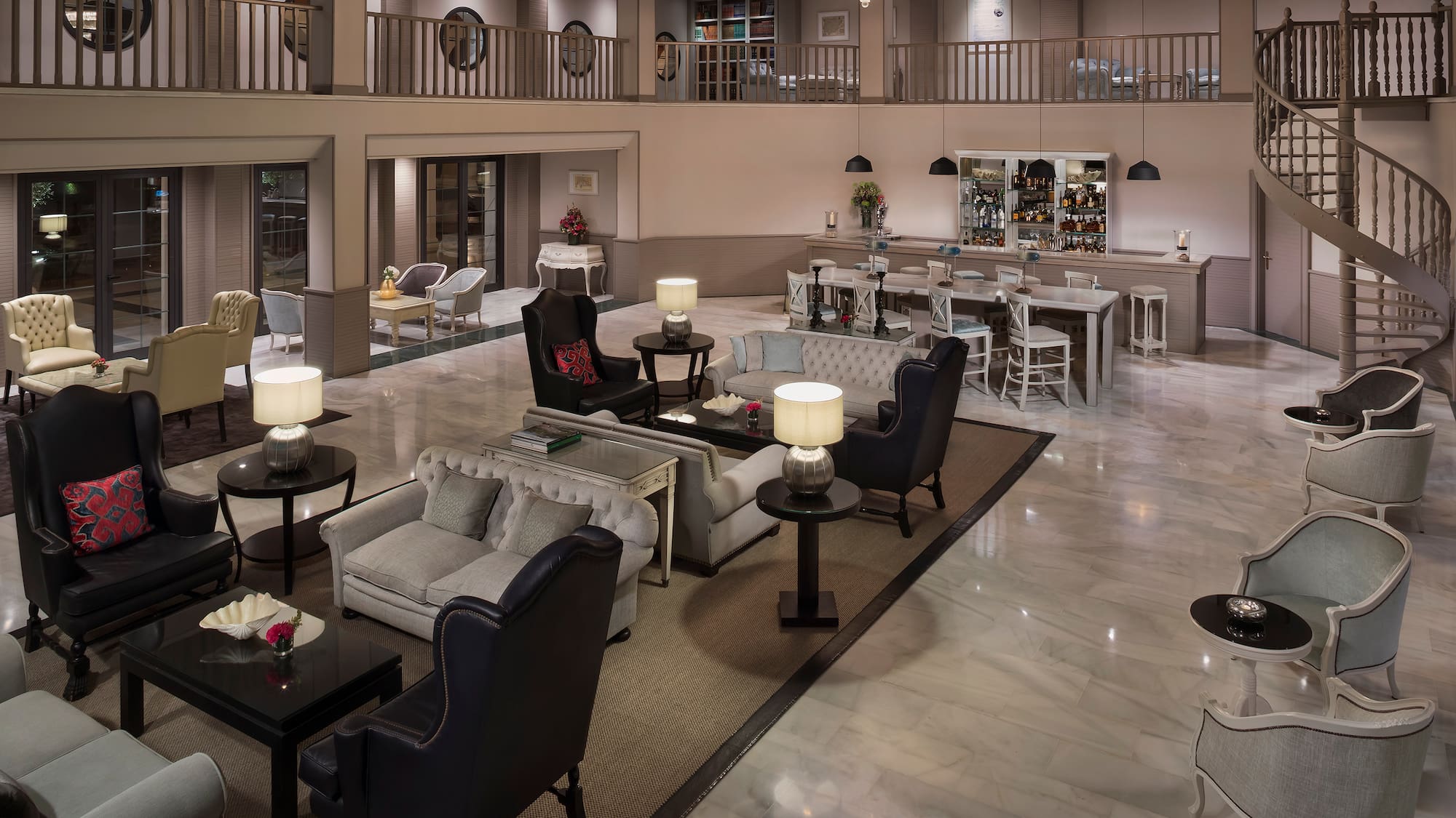 a large room with a large chandelier and chairs
