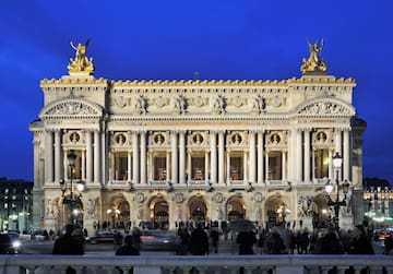 a large building with columns and statues with Palais Garnier in the background