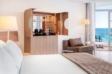 a room with a bed and a coffee maker