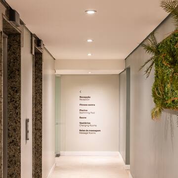 a hallway with plants on the wall