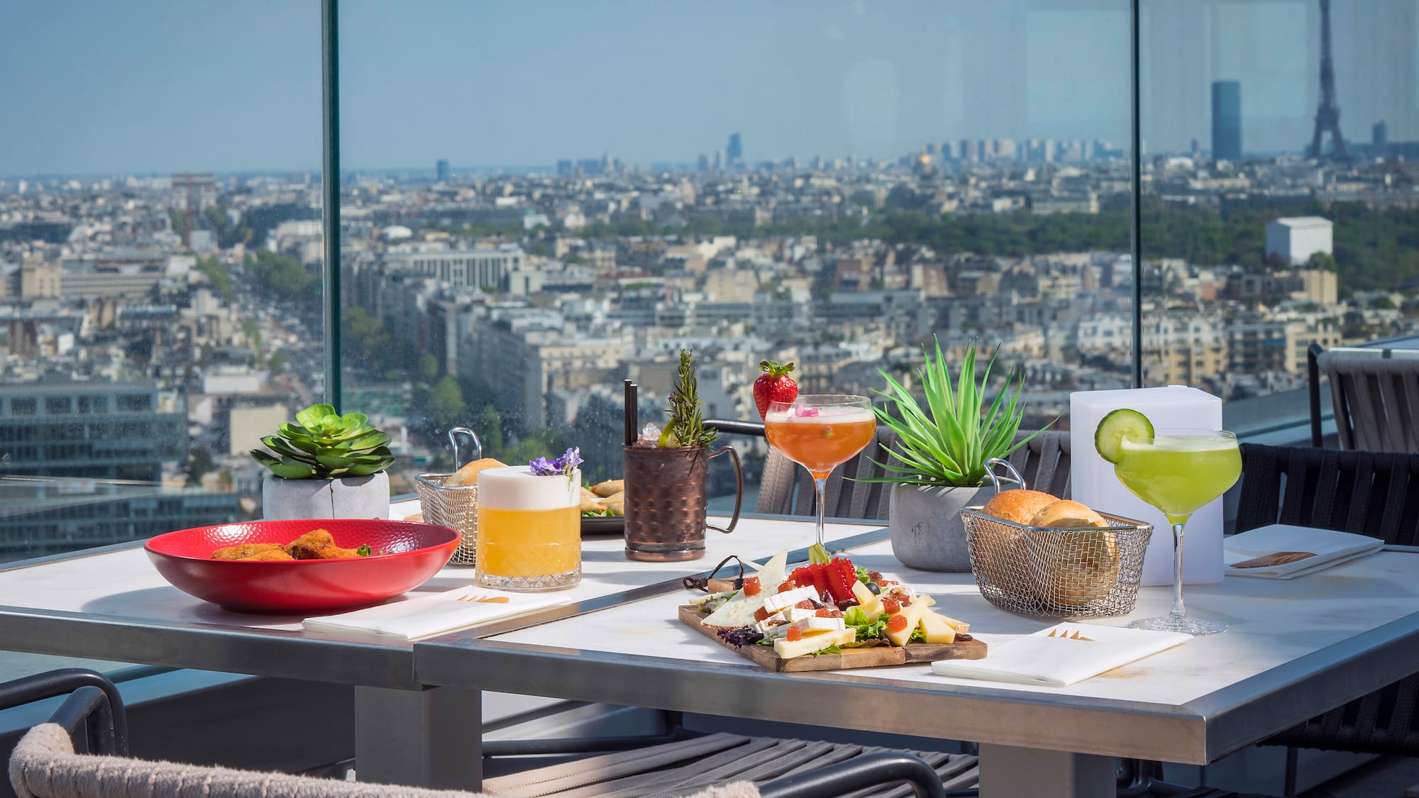 a table with food on it and a view of a city