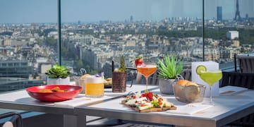 a table with food on it and a view of a city