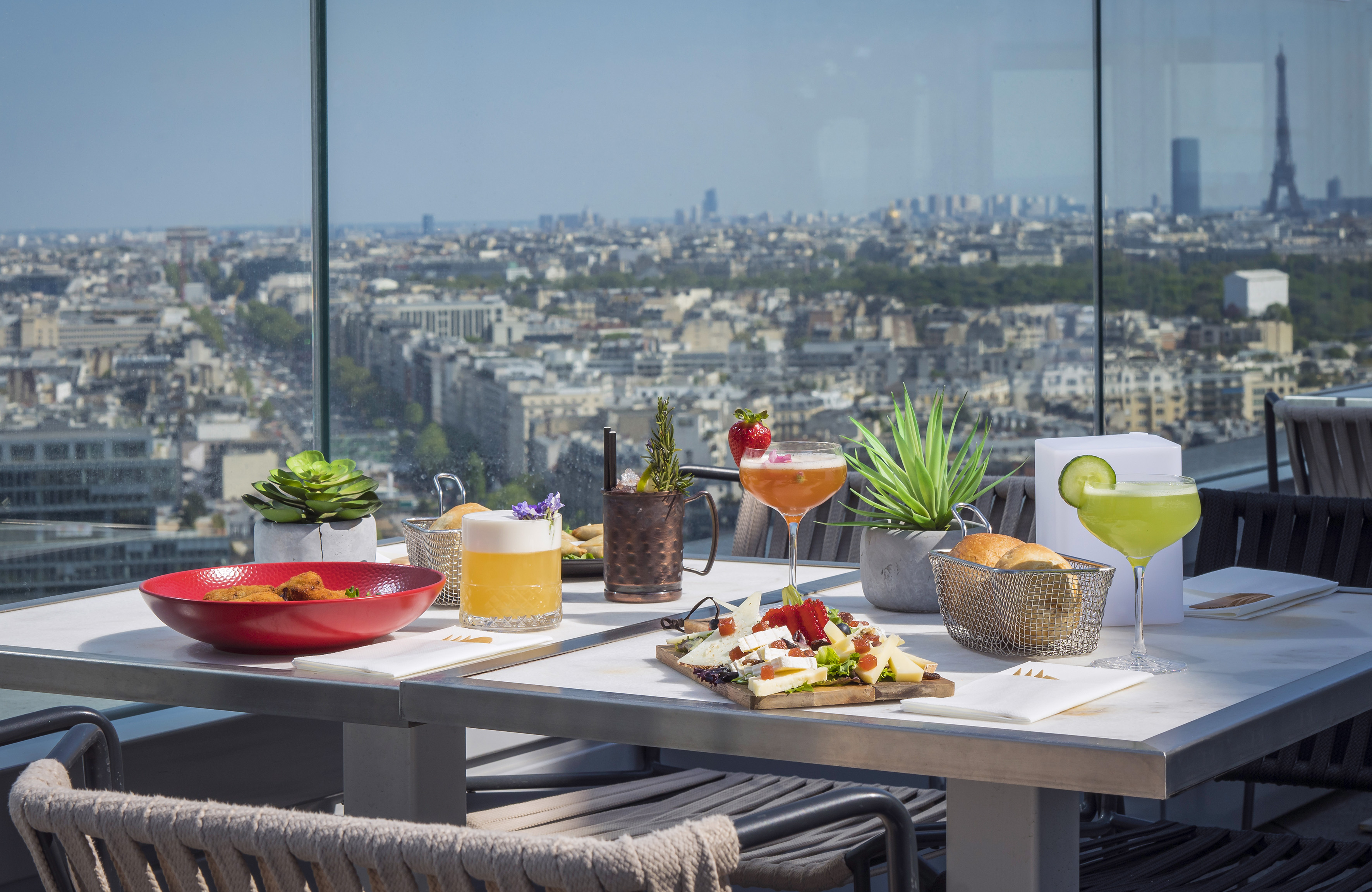 a table with food on it and a view of a city