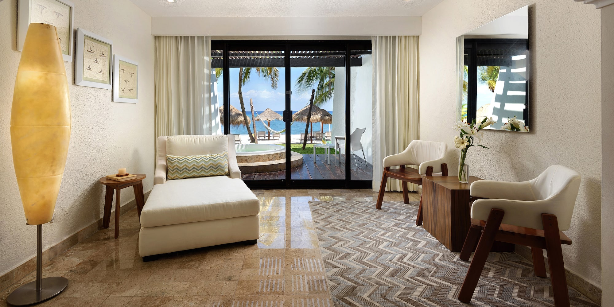 a room with a glass door and a couch