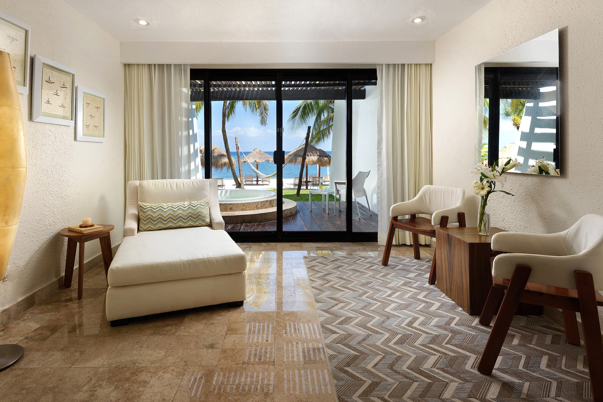 a room with a glass door and a couch