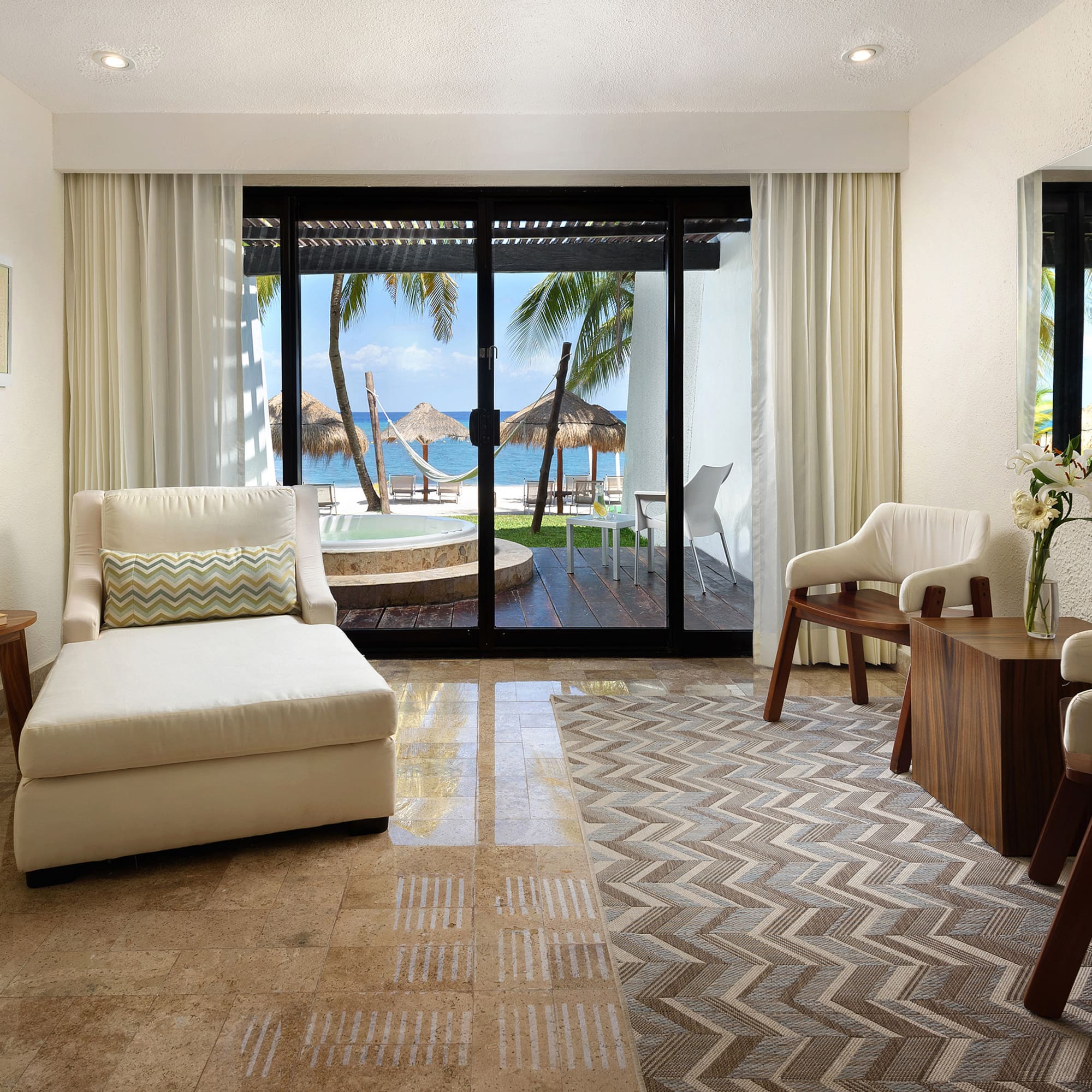 a room with a glass door and a couch