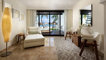 a room with a glass door and a couch