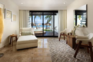 a room with a glass door and a couch