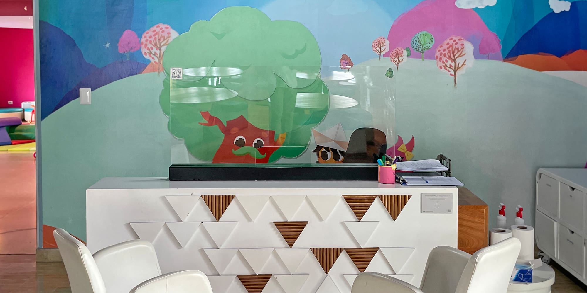 a room with a colorful wall mural