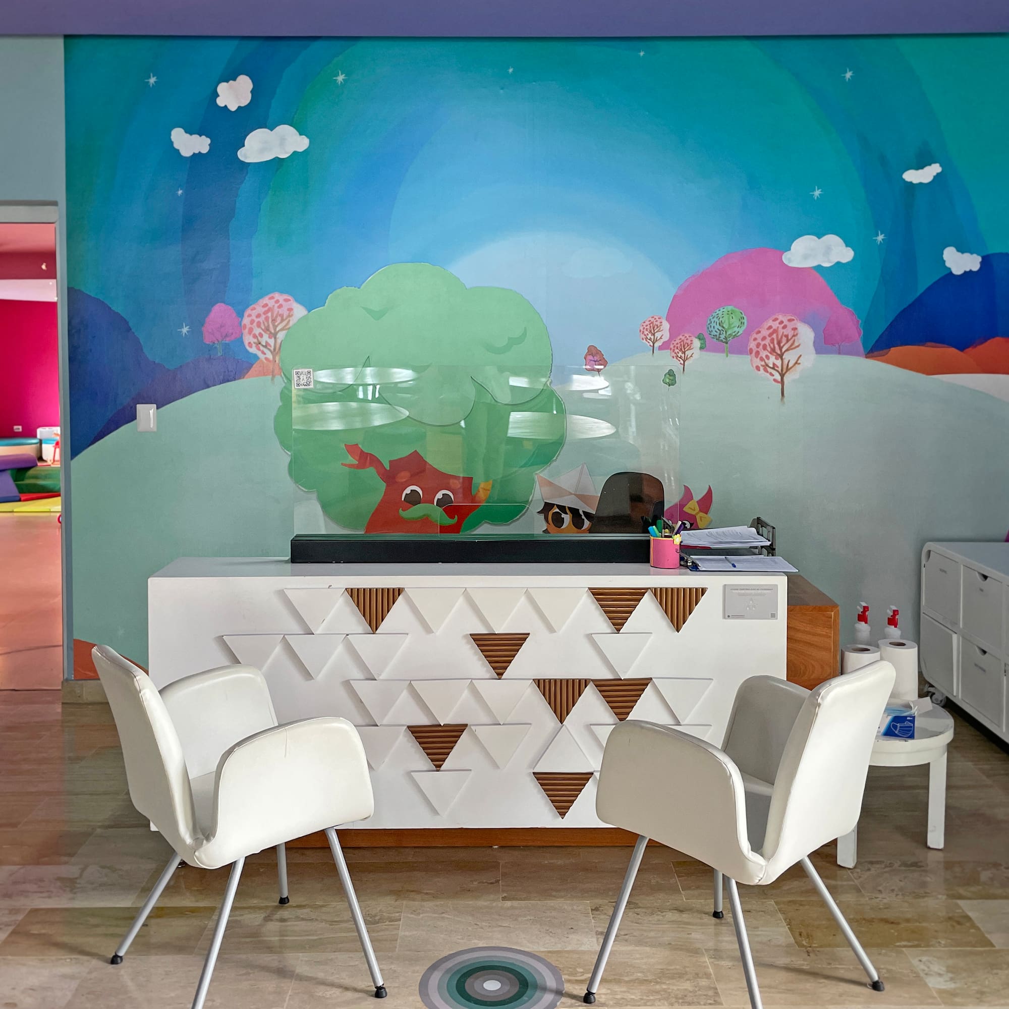 a room with a colorful wall mural