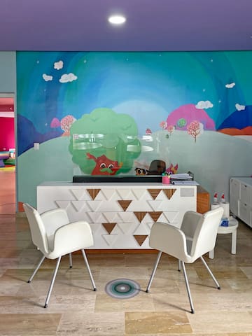 a room with a colorful wall mural