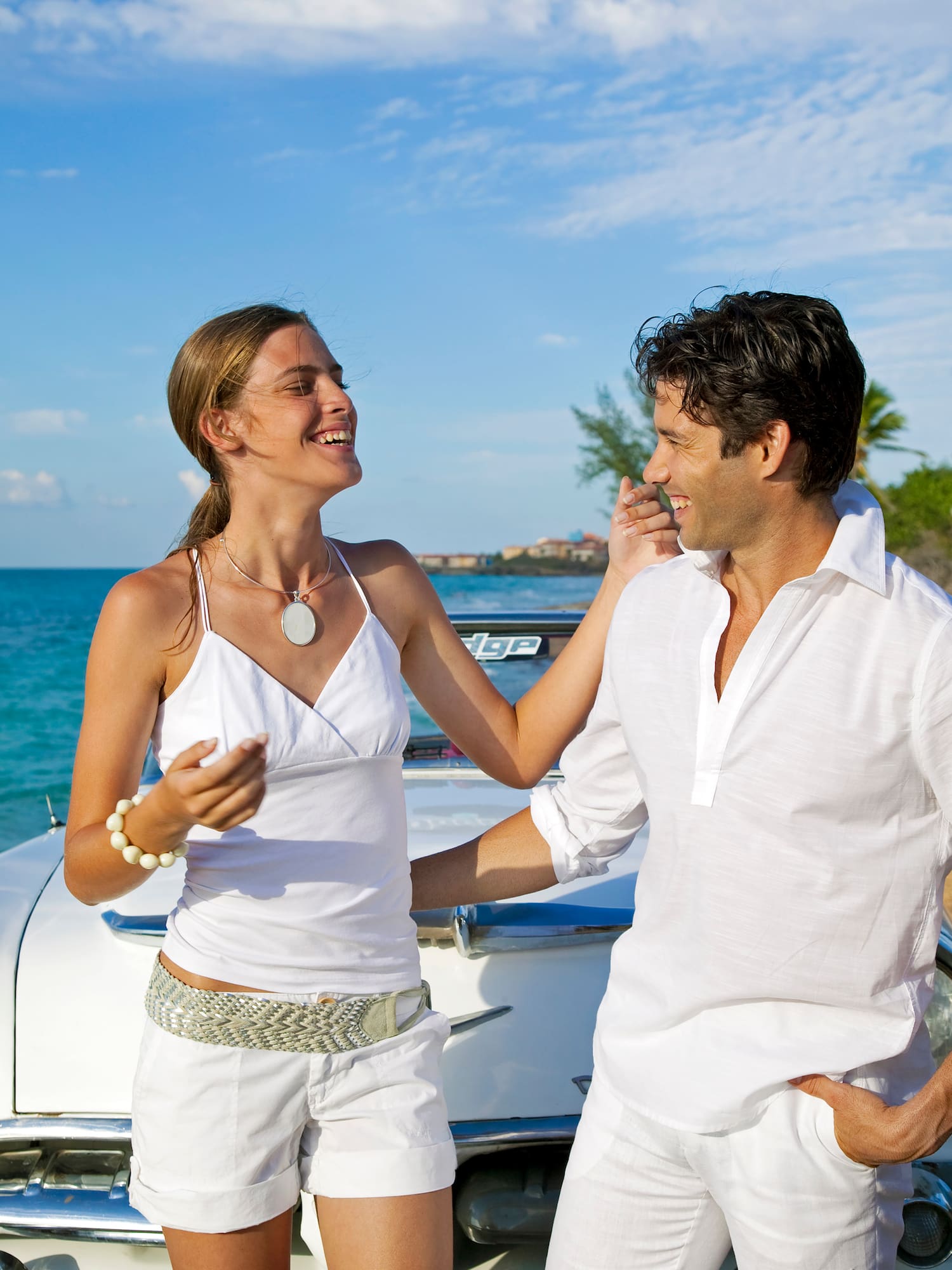 a man and woman standing on a boat
