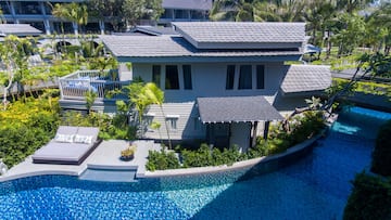 a house with a pool in the background