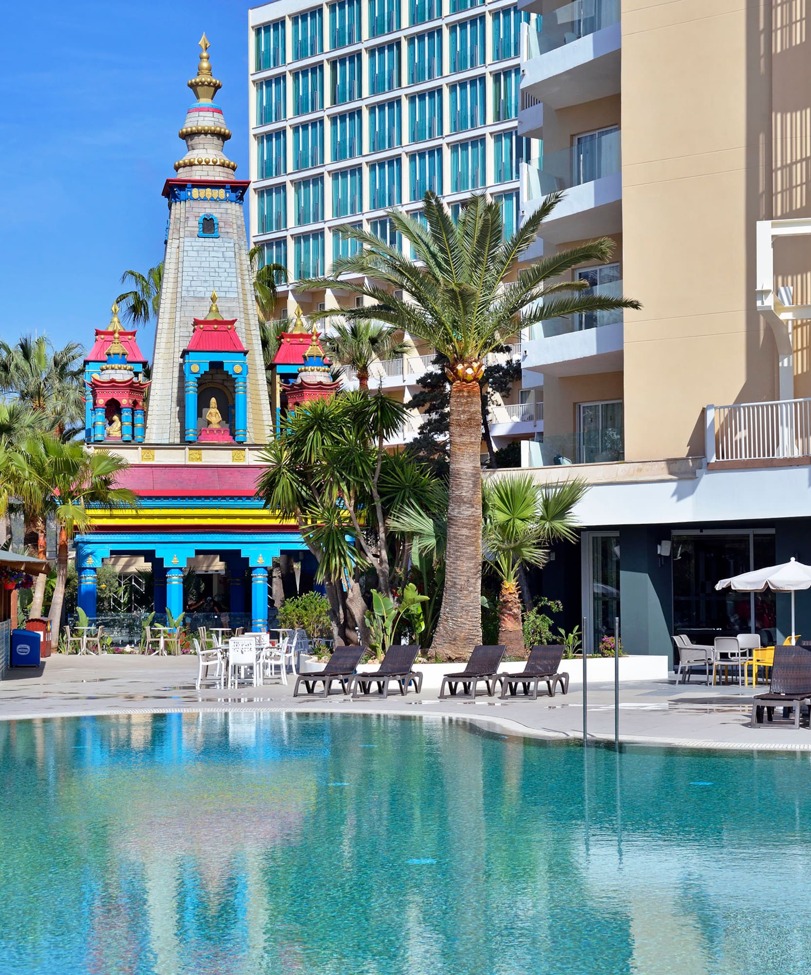 a pool with a building in the background