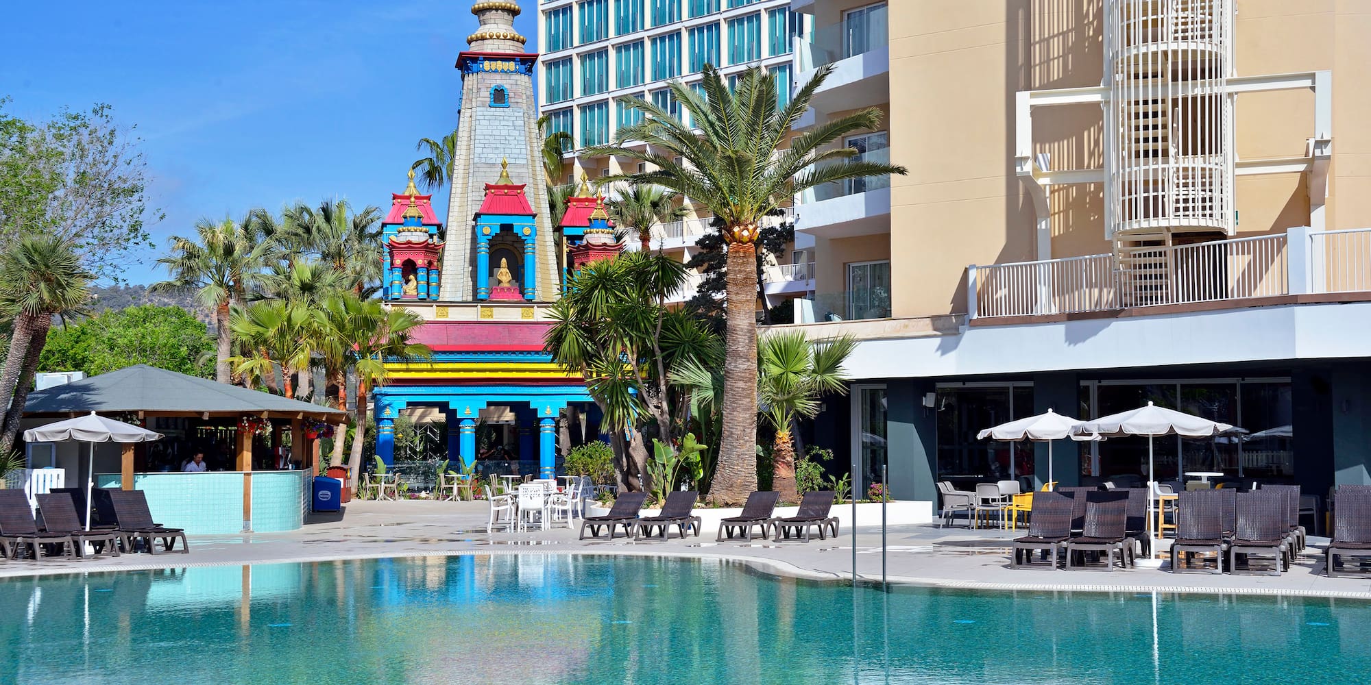 a pool with a building in the background