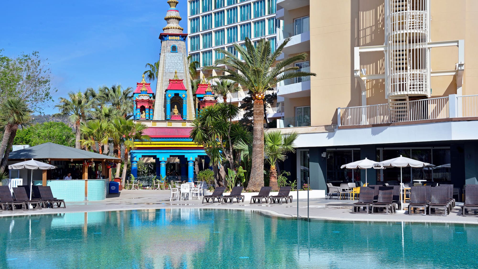a pool with a building in the background