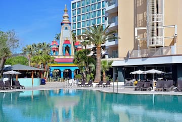 a pool with a building in the background