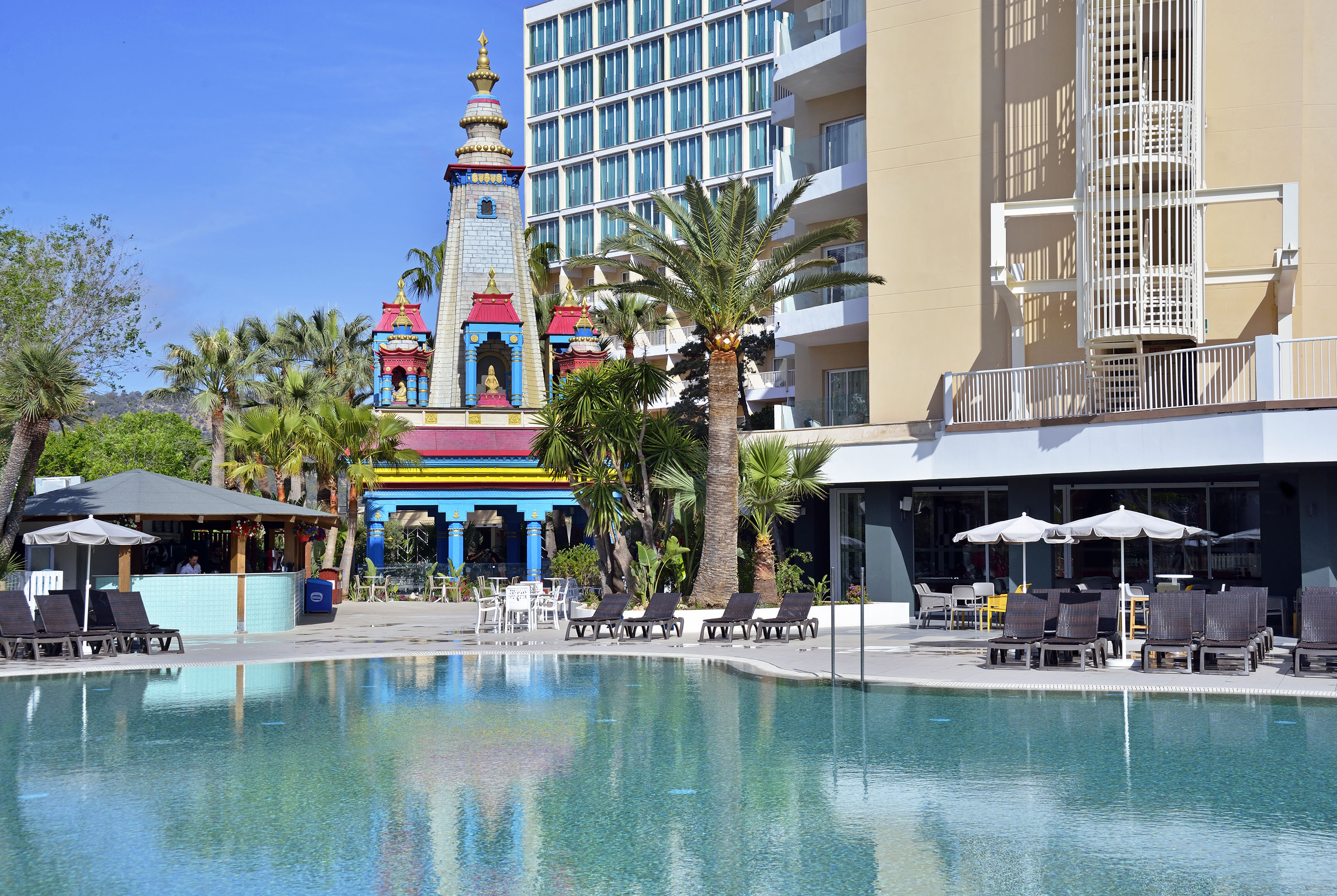 a pool with a building in the background