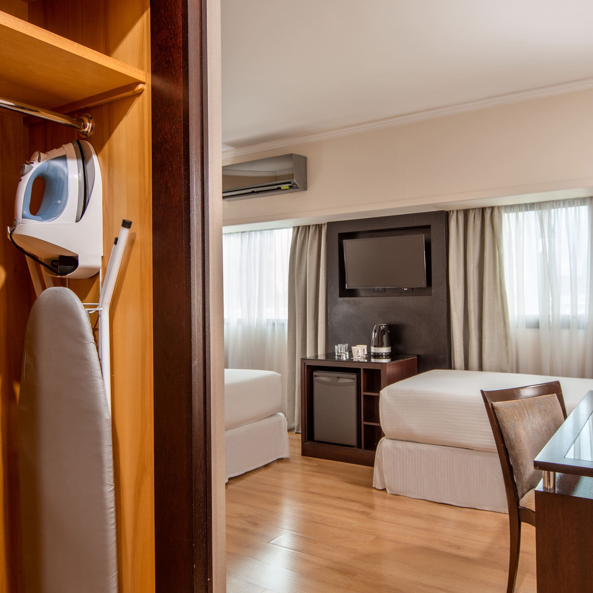 a room with a bed and a iron