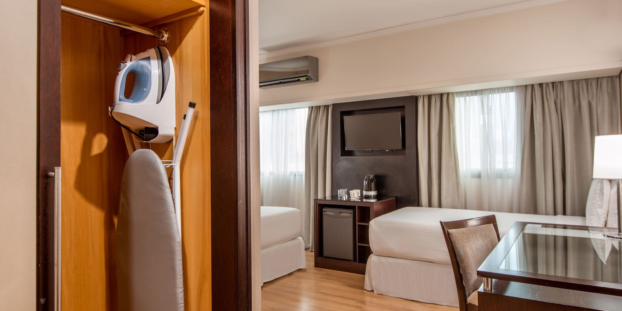 a room with a bed and a iron