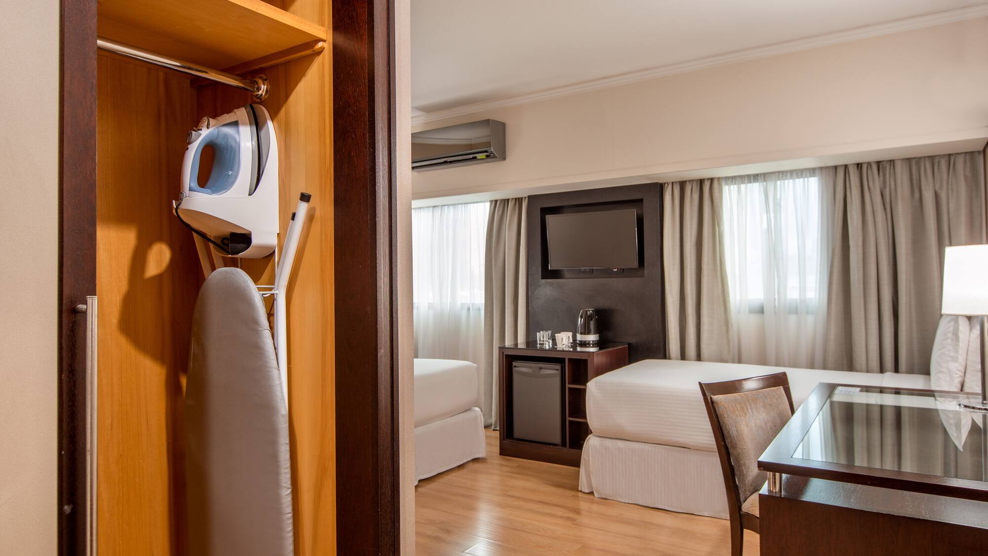 a room with a bed and a iron