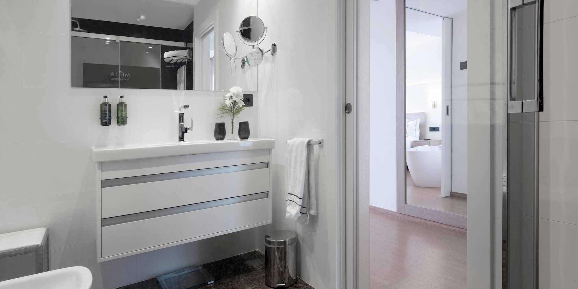 a bathroom with a mirror and sink