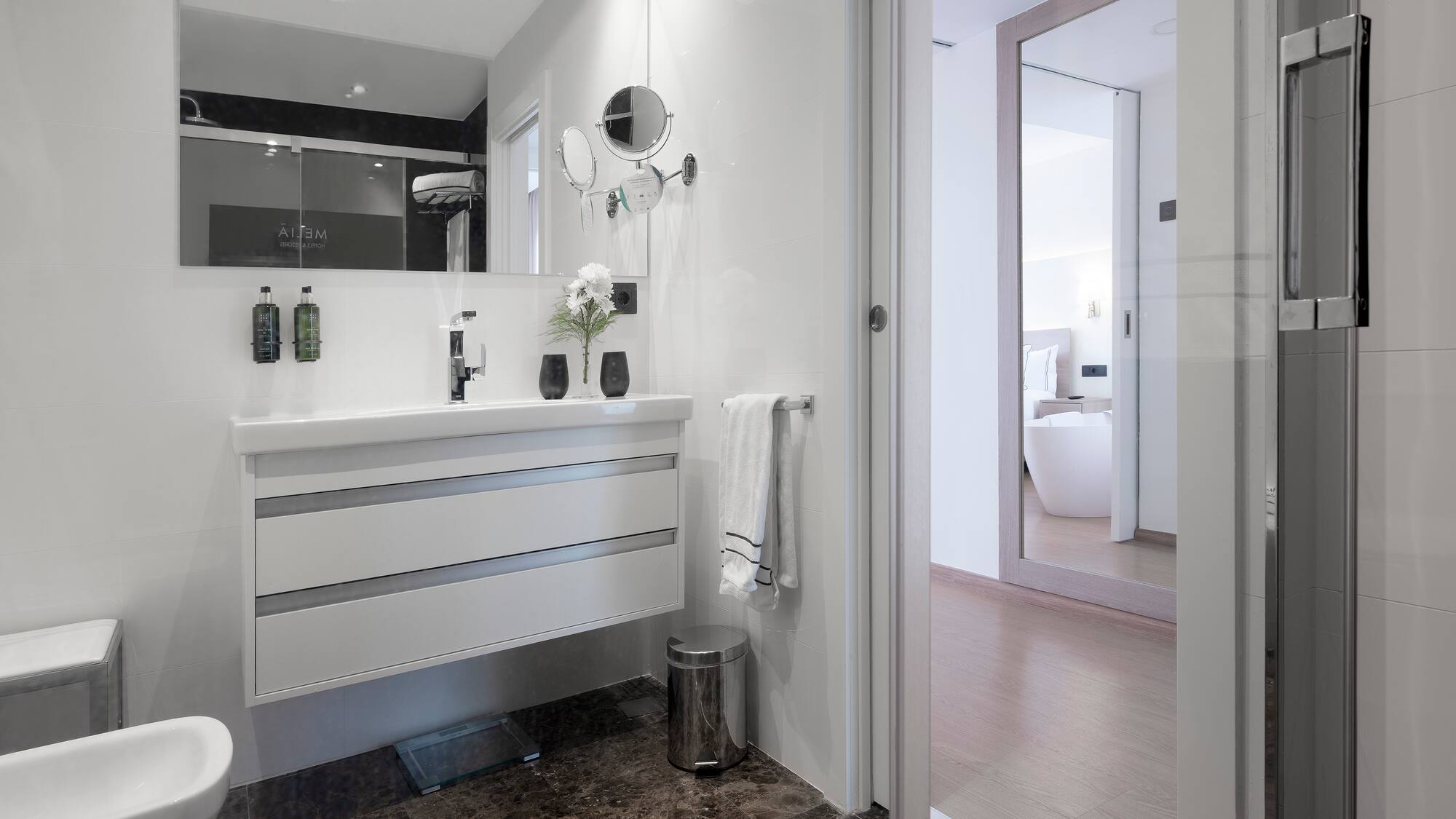 a bathroom with a mirror and sink