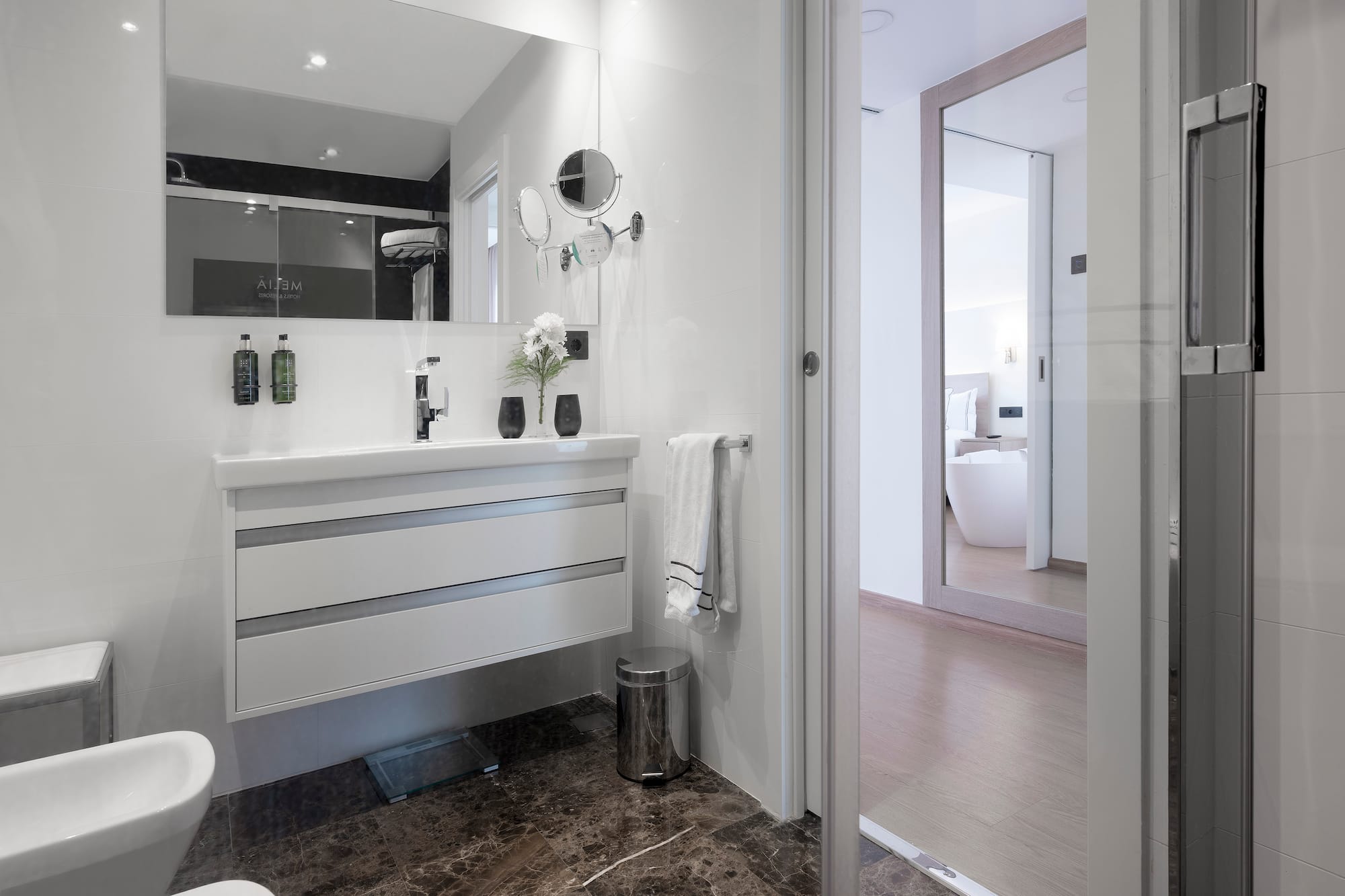 a bathroom with a mirror and sink