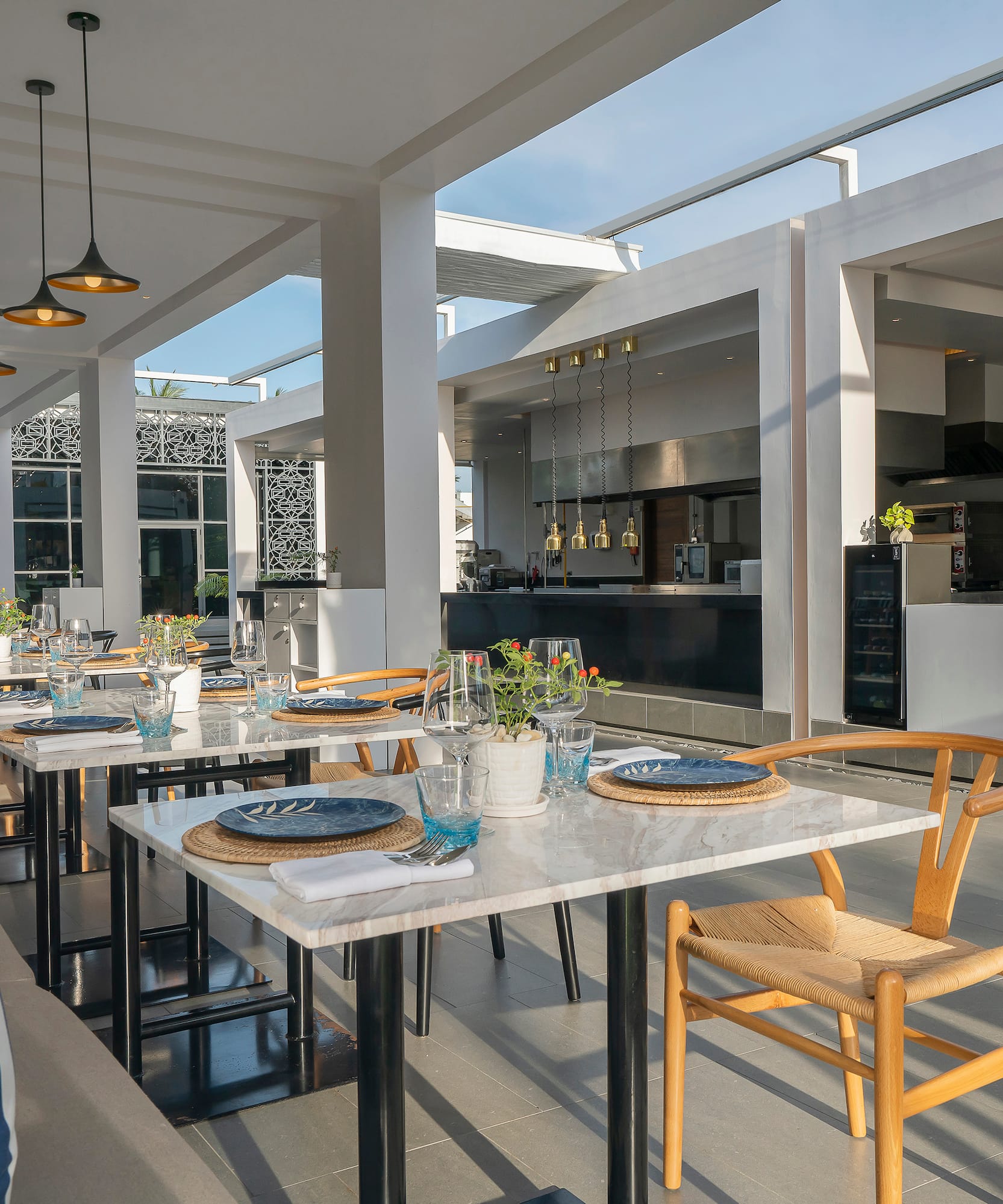 a table set up in a room with a couch and chairs