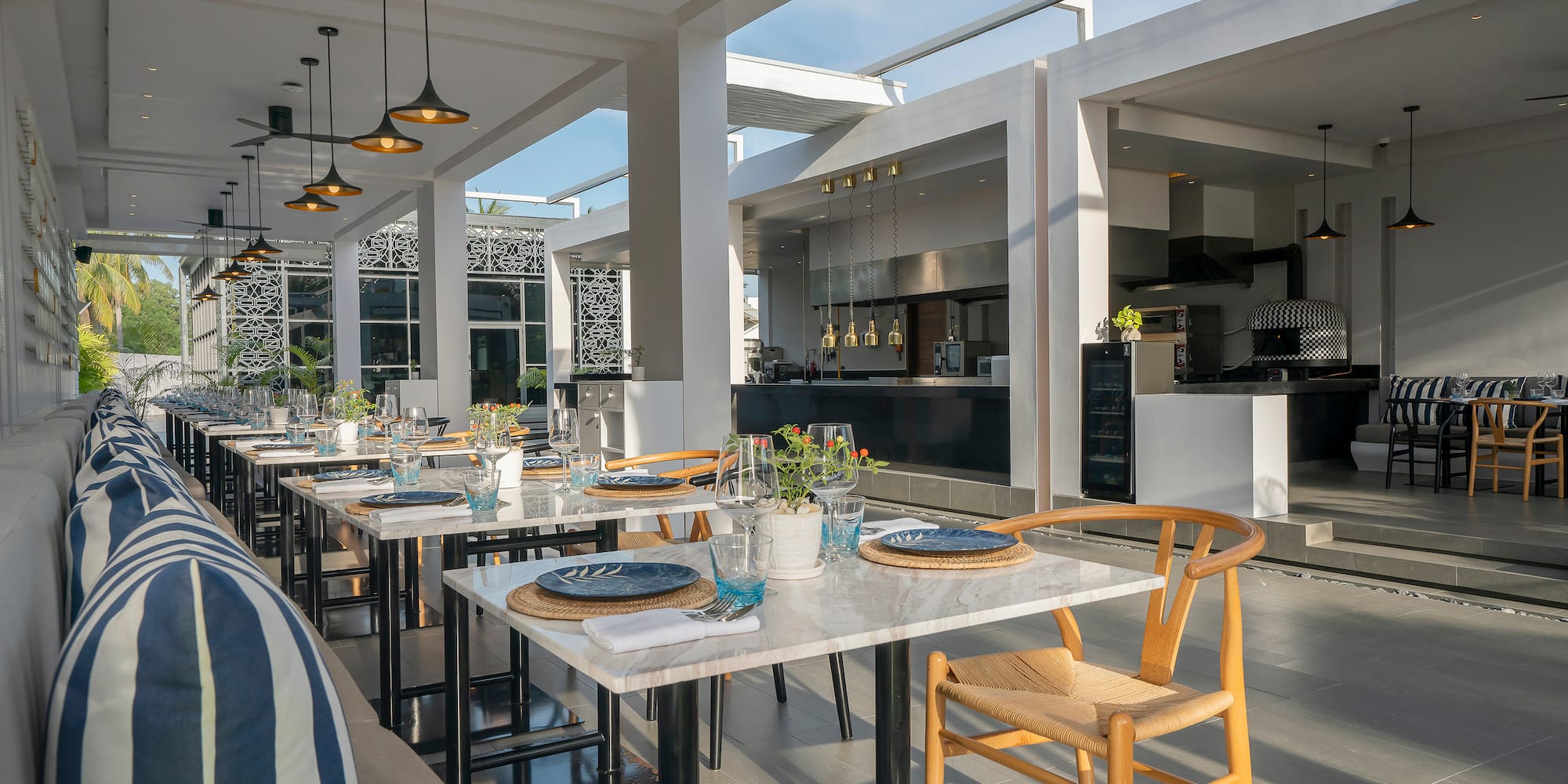 a table set up in a room with a couch and chairs