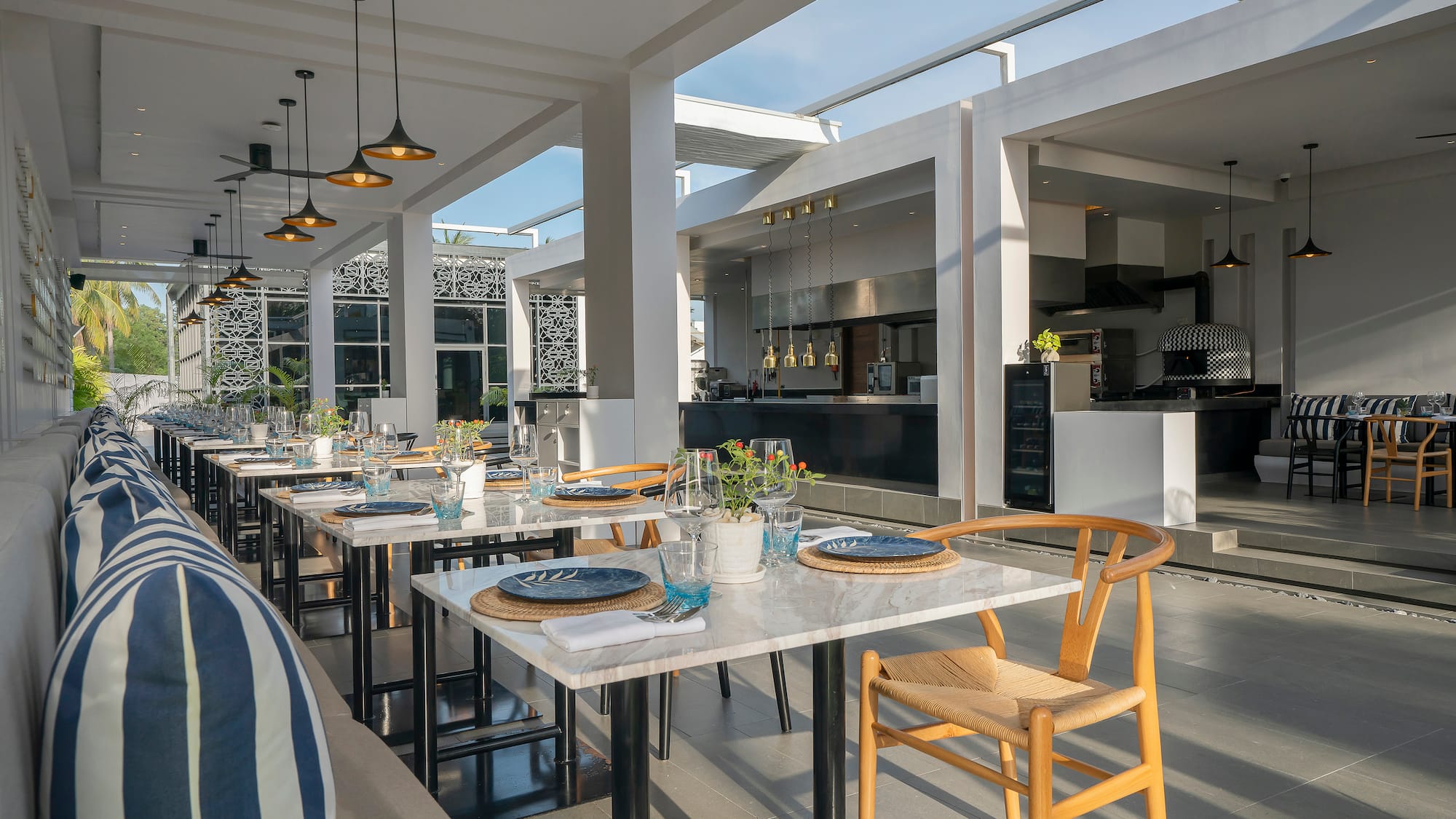 a table set up in a room with a couch and chairs