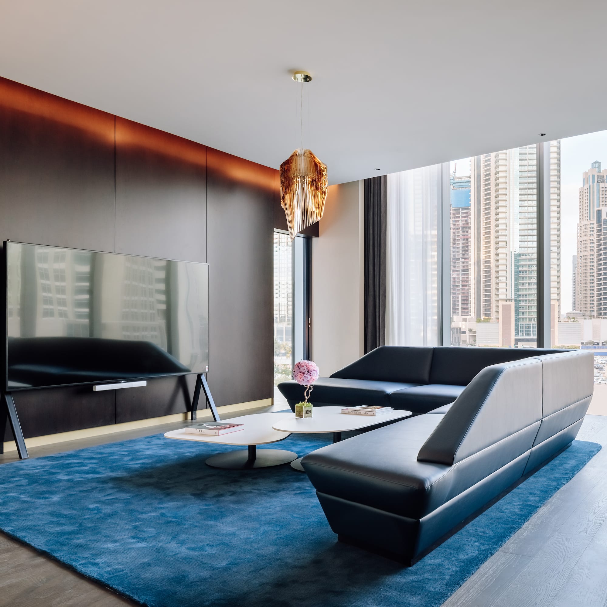 a living room with a couch and a tv