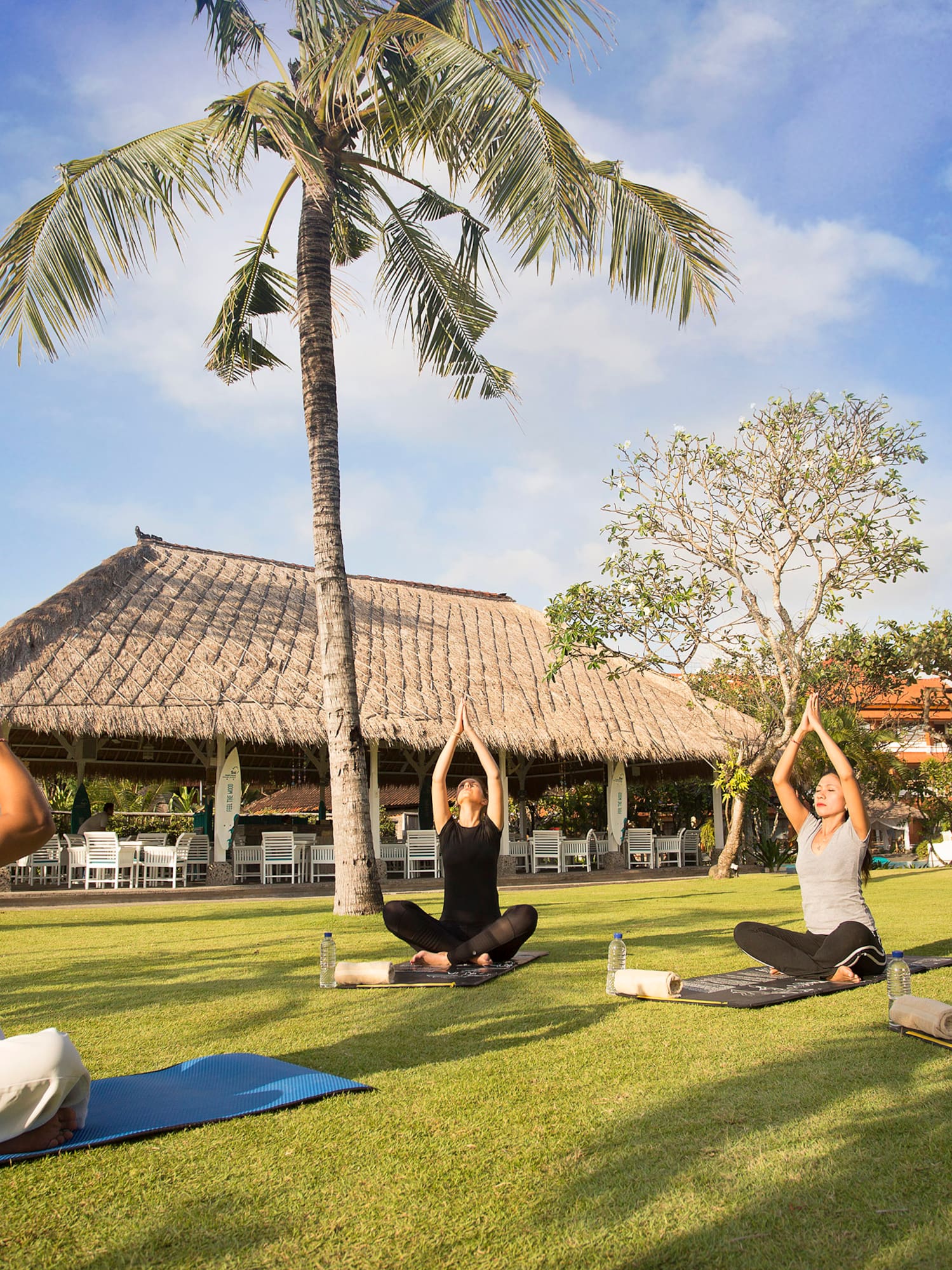 a group of people doing yoga outside