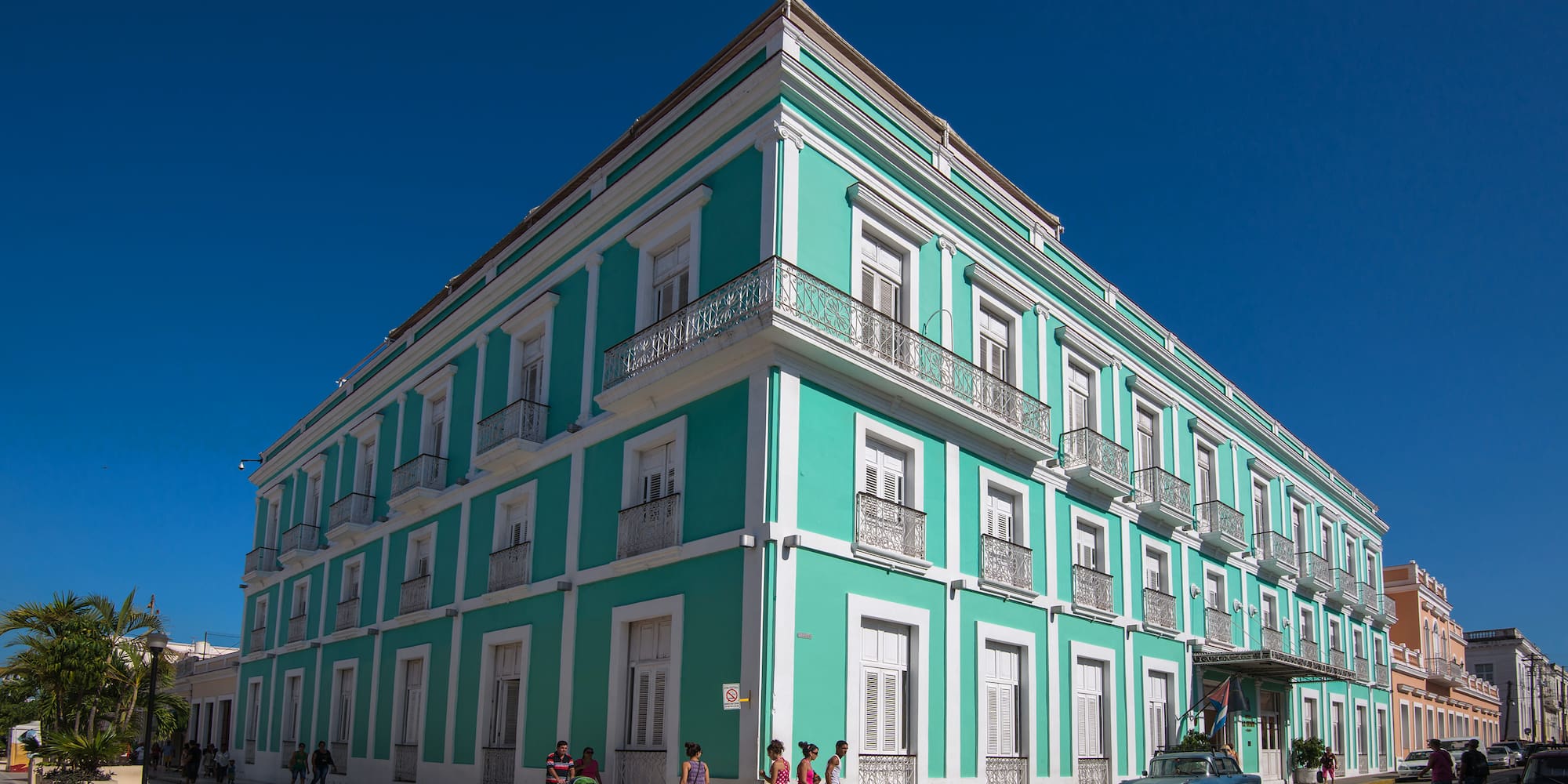 a building with people walking on the street