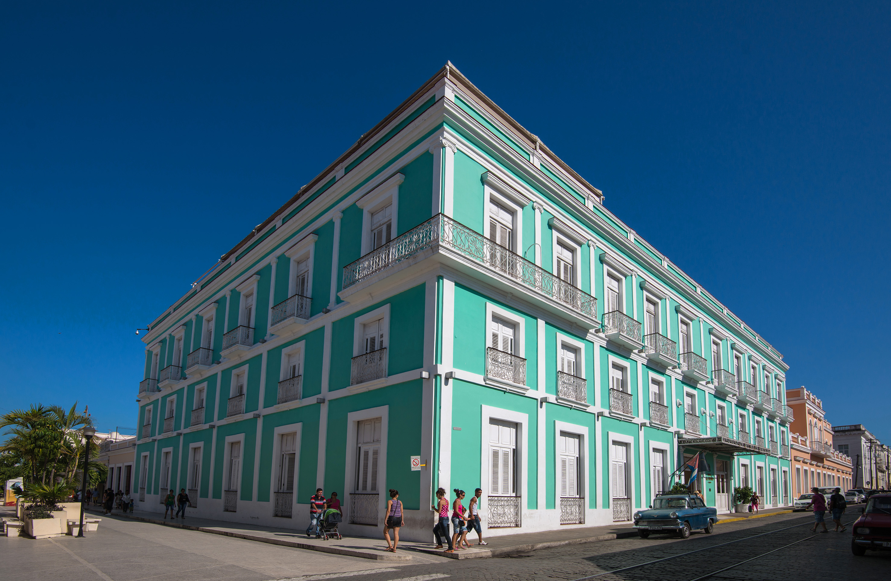a building with people walking on the street