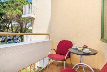 a table and chair on a balcony