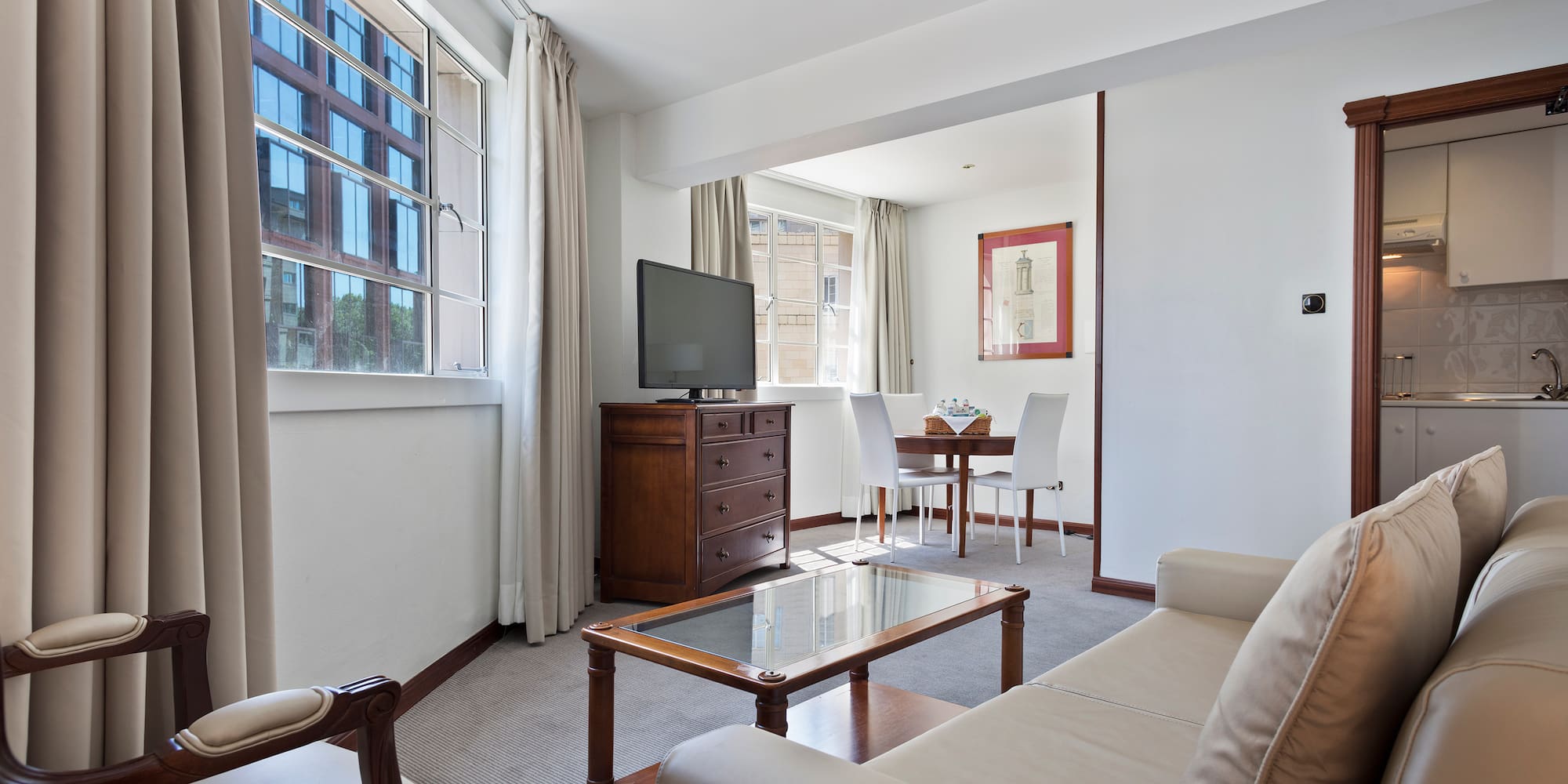 a living room with a television and a table