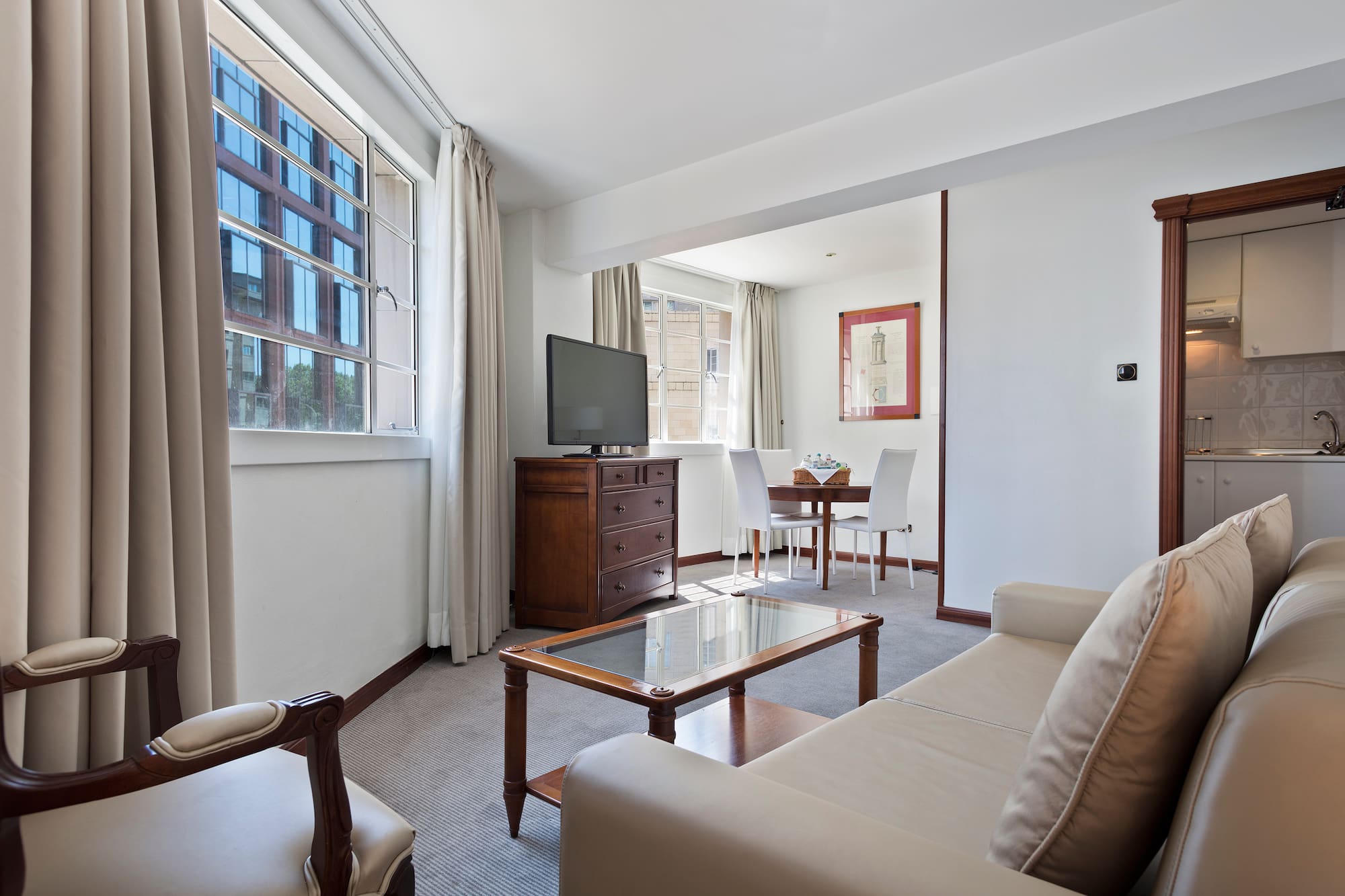 a living room with a television and a table