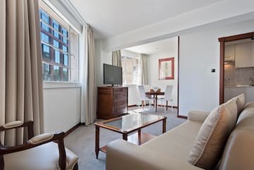 a living room with a television and a table