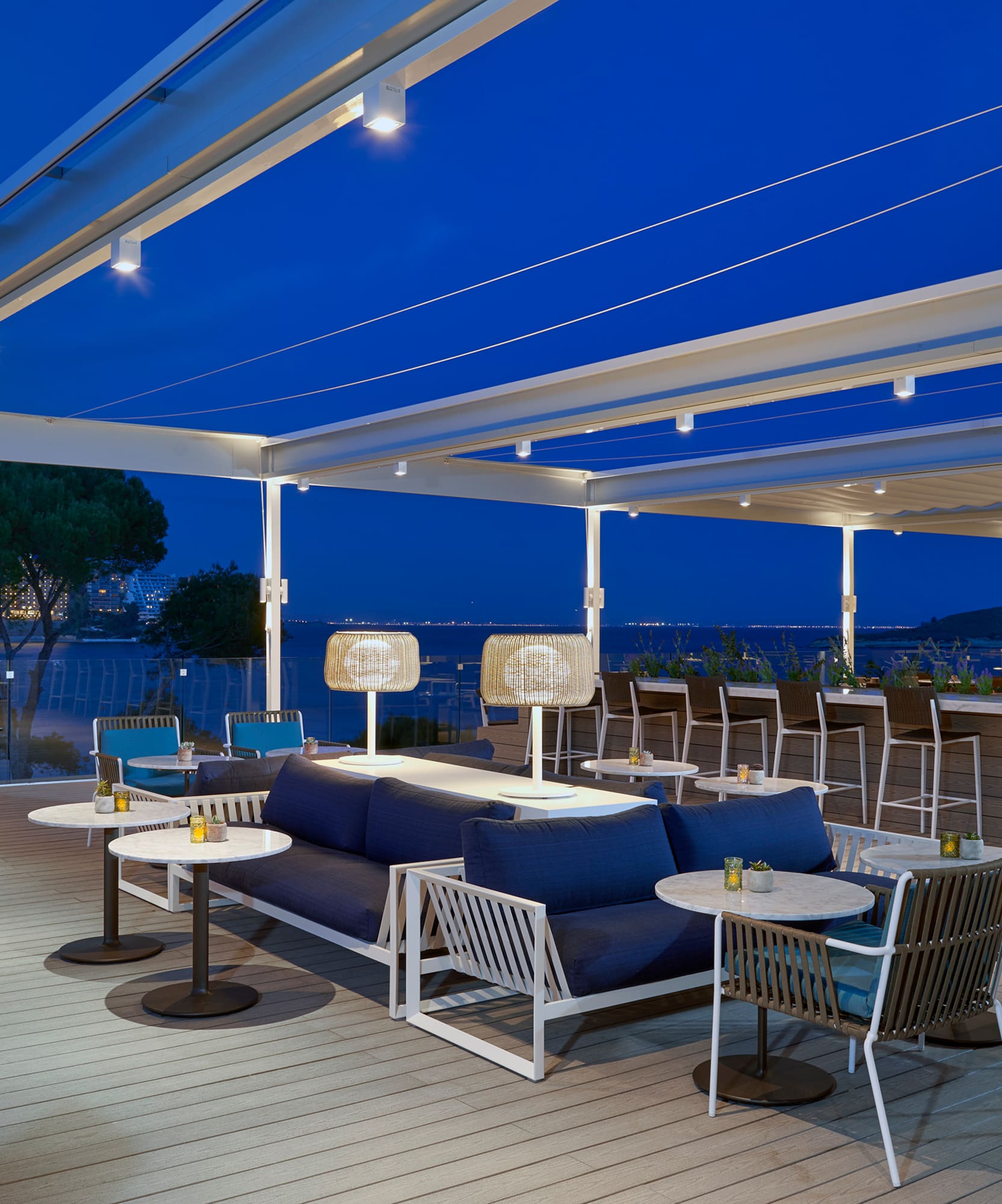 a patio with tables and chairs