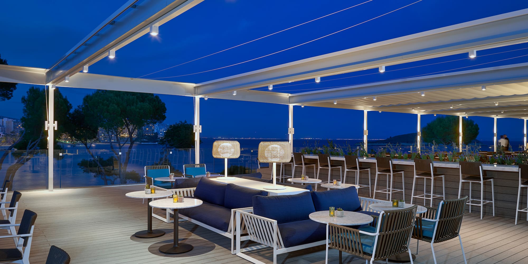 a patio with tables and chairs