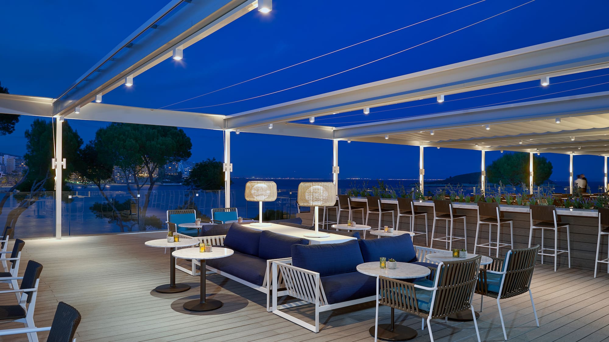 a patio with tables and chairs
