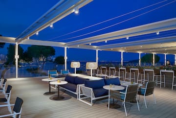 a patio with tables and chairs